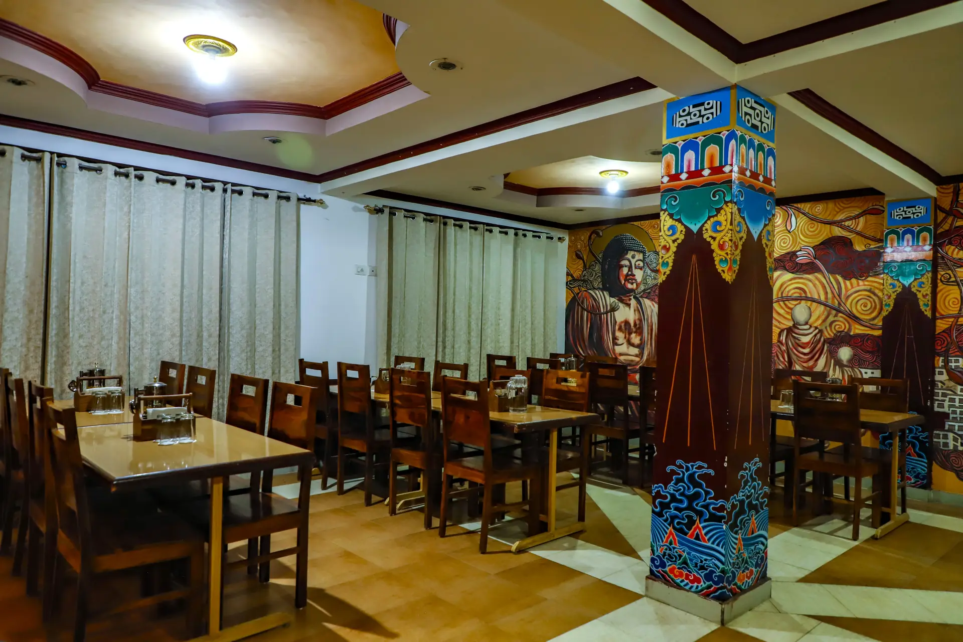 Delek Cafe interior with traditional wooden furniture and mural