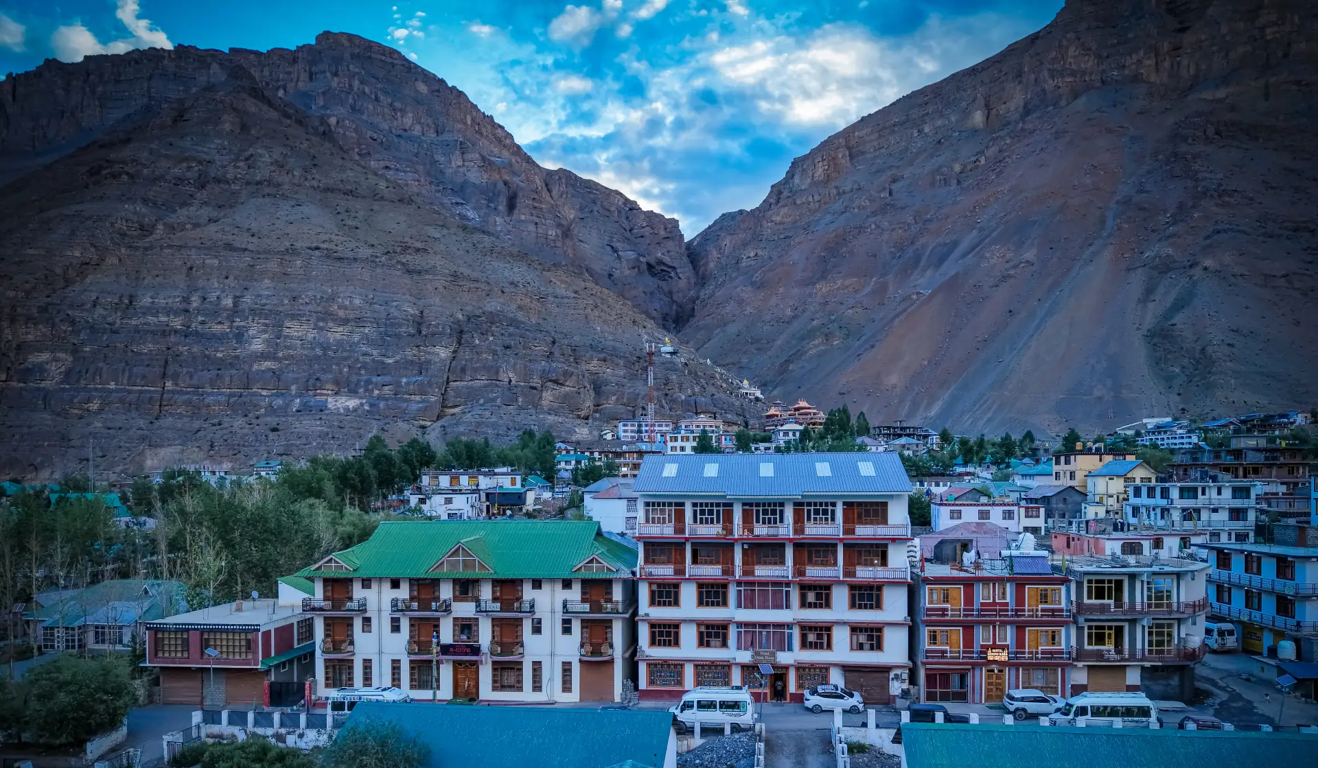 The Delek House Kaza aerial view surrounded by Spiti Valley mountains